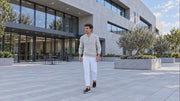 Verbier Half Zip Sweater in grey, worn outdoors by model M1.
